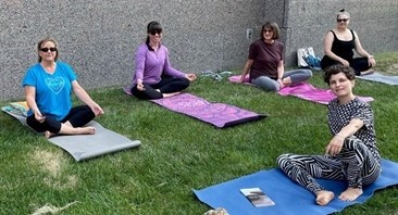 Elizabeth-left-and-colleagues-doing-yoga.jpg