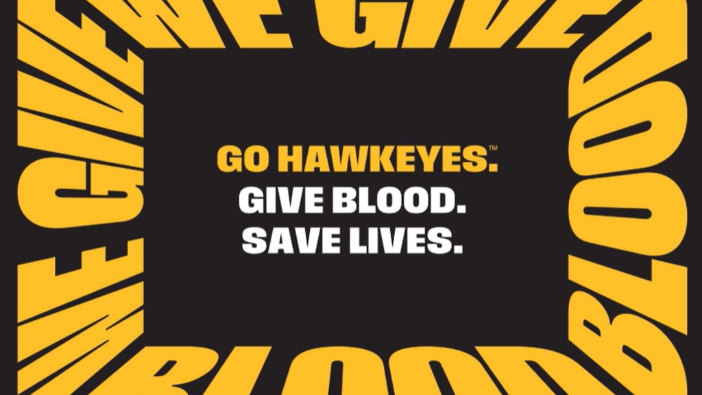 Black and Gold “We Give Blood” logo with Go Hawkeyes; Give Blood; Save Lives in the middle.